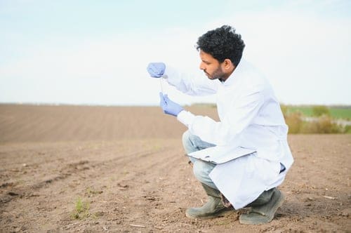 soil-test-indian-agronomist-putting-soil-with-gar-2024-02-08-19-29-51-utc