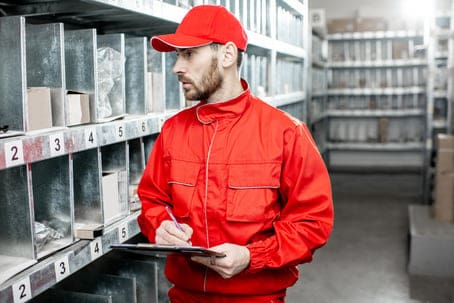 warehouse-worker-with-clipboard-in-the-storage-2021-12-09-01-20-47-utc