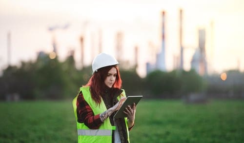young-woman-engineer-with-tablet-standing-outdoors-2022-02-02-04-48-51-utc